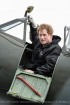 Prince Harry visits the Boultbee Flight Academy on 15/02/2014 at Goodwood Motor Circuit, Goodwood. The Prince sat in the cockpit of a Spitfire aircraft as it's engines were turned over outside a hanger. Picture by Julie Edwards