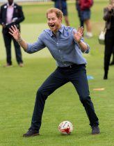 Prince Harry takes part in sports activities during a visit to celebrate the expansion of Coach Core at Lord's Cricket Ground in London