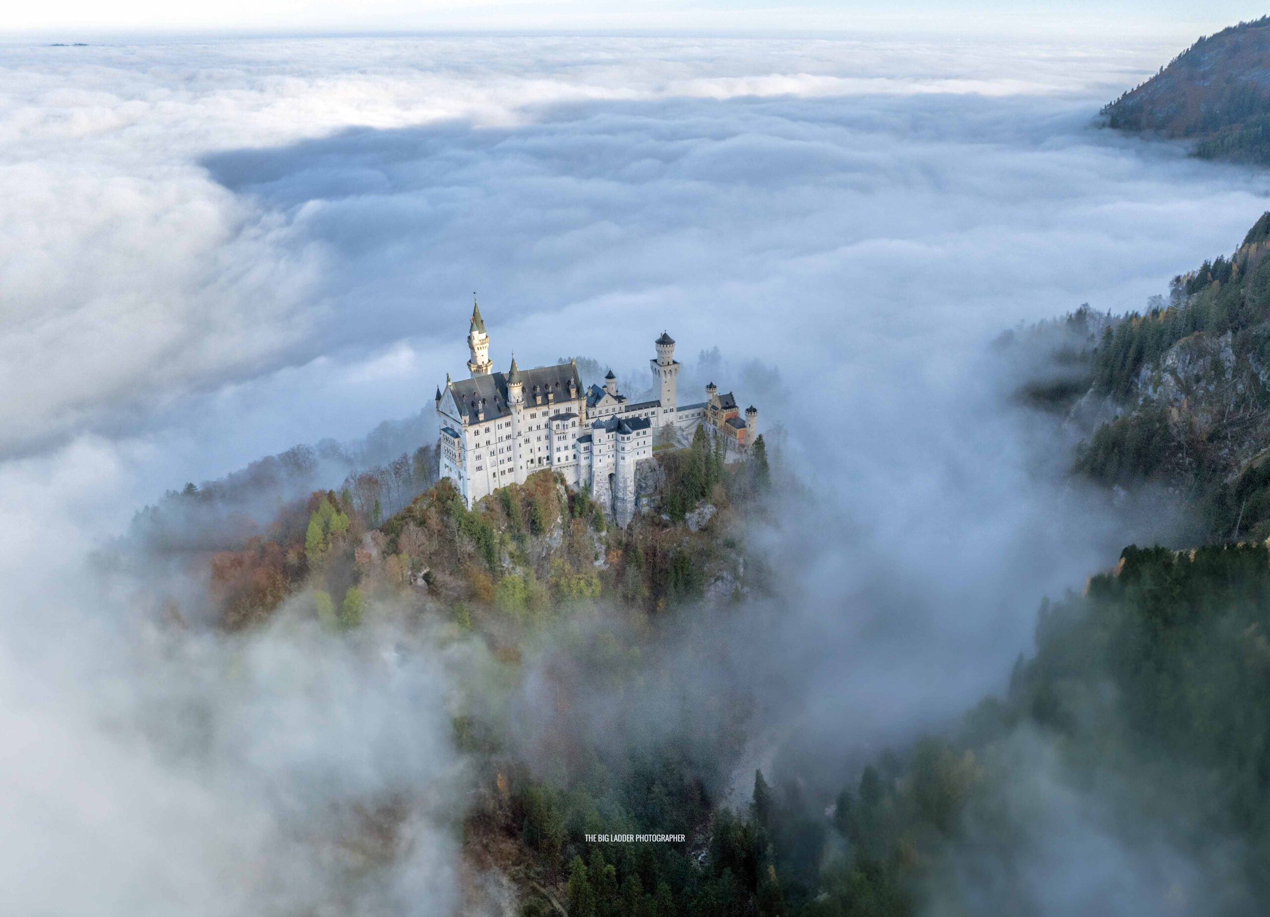 GERMANY - BAVARIA: Morning mist surrounds Neuschwanstein Castle built on a rock ledge over the Pöllat Gorge in the Bavarian Alps in Southern Germany. Built  by order of Bavaria’s King Louis II “Mad King Ludwig”.  Construction began in 1868.
The Castle is best known for being the inspiration for Disneys "Sleeping Beauty Castle"
The castle also featured in Chitty Chitty Bang Bang.
During  World War 2 Nazi germany stored Stolen art here.
Photograph By Chris Gorman / BIg Ladder. Taken today: 31th October 2024.