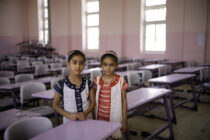 Sisters Ahlaa and Masra at their first day back at Abi Tamam school in Mosul. They survived the bombardment on the city by hiding in a cave under their home for three months with 47 other members of their family.
The battle for Mosul lasted from November 2016 until July 2017. It is estimated that at least ten thousand civilians were killed in the fighting, many by the so called Islamic State but also in the fighting between IS and Iraqi Army but also by western coalition air strikes. Most of the fighting was in the Old City district of west Mosul where I.S. were holed up in the narrow alleys. I shot these photographs on assignment to mark the 1st anniversary of the battle for Mosul to retake IraqiÕs 2nd largest city from Isis. Over 8 thousand homes were destroyed during the conflict and even today a lot of the buildings remain destroyed and have yet to be rebuilt.
Photo:Philip Coburn