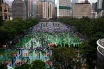 People gather at Victoria Park in Hong Kong for a protest against being subject to the more draconian laws that exist on the Chinese mainland. The Park holds 100,000 people and twice that amount were outside. Over two million people protested on that day in Hong Kong despite a ban on any form of non licensed protests on that day.
Photo:Philip Coburn