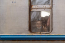 Young Ukrainian refugee shows V sign after arriving in Przemysl, Poland by train from Lviv, Ukraine. 03 March 2022
