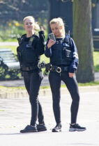 ©Licensed to London News Pictures 26/03/2020
Greenwich, UK. Two police officers having a selfie moment. People get out and about in Greenwich Park, Greenwich, London this afternoon as they make the most of their permitted one a day exercise out of the house from Coronavirus Lockdown. The Prime Minister Boris Johnson has asked people to stay at home to help in the fight against Covid-19. Photo credit:LNP