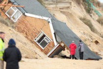 HOUSES THAT WERE PARTLY SWEPT INTO THE SEA AFTER ONE OF THE BIGGEST TIDAL SURGES SINCE 1953 HIT THE TOWN OF HEMSBY IN NORFOLK.7.12.13.PIX STEVE BUTLER 07970 430606