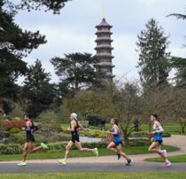 Kew, England. 26 March, 2021. The men's marathon leaders run past The Pagoda at the Muller British Athletics Marathon and 20km Walk Trials reminding them that winning means a trip to the Tokyo Olympics. Credit: Nigel Bramley