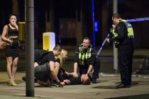 03/06/2017. London, UK. Police officers attend to a man collapsed on the floor near London Bridge, following reports of a vehicle being deliberately driven at pedestrians crossing London Bridge.