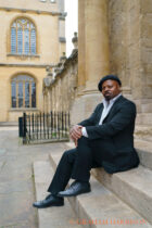 Ben Okri, 1991 Booker prize-winning novelist to on steps beside the Sheldonian Theatre during the FT Weekend Oxford Literary Festival, 27 March 2022. Photo © Graham Harrison
