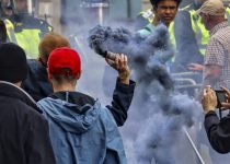Protestor throws smoke grenade during DFLA & BLM protest