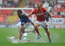Chris Solly of Charlton Athletic clashes with Chris Brown of Doncaster Rovers-Charlton Athleic v Doncaster Rovers-Sky Bet Championship Football at the Valley 23/08/2013-© Martin Dalton-10 Cole Avenue Chadwell St Mary Grays Essex RM16 4JN UK-07973 225164-e-mail: pictures@martindalton.com