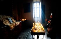 A woman prays for the souls of those who died in a Gyumri church. 10 years on from the Armenian earthquake. 6 December 1998, Gyumri, Armenia. Photo: Edmond Terakopian