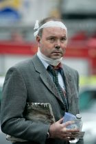 A commuter, one of many walking wounded, leaves the Edgware Road Underground Station, still clutching his morning paper. A suicide bomber blew himself up on a tube train at the station, killing seven passengers. This was one of four terrorist attacks on the transport system, resulting in 52 innocent deaths. London, 7 July 2005.
Photo: Edmond Terakopian