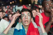 Eiffel Tower Fan Zone, Paris, France. 10th June, 2016. Football fans react to the game between France and Romania at the Eiffel Tower Fan Zone in Paris. Pictured:  A French supporters waits on tenter hooks as Romania's Bogdan Stancu is about to take a penalty. // Lee Thomas, Flat 47a Park East Building, Bow Quarter, London, E3 2UT. Tel. 07784142973. Email: leepthomas@gmail.com. www.leept.co.uk (0000635435)