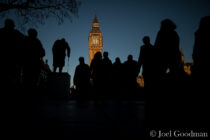 © Licensed to London News Pictures . 25/03/2017 . London , UK . People crossing Parliament Square at sunset , silhouetted against a clear blue sky over Parliament and the Elizabeth Tower , after a warm spring day , ahead of the start of British Summer Time . Photo credit : Joel Goodman/LNP
