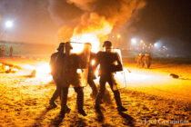 © Joel Goodman - 07973 332324 . 23/10/2016 . Calais , France . Riot police charge residents at the Calais migrant camp known as " The Jungle " , in Northern France , on the evening before the start of the eviction and destruction of the camp . Photo credit : Joel Goodman