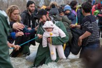 IDOMENI, GREECE - MARCH 14:  Migrants try to cross a river after leaving the Idomeni refugee camp on March 13, 2016 in Idomeni, Greece. The decision by Macedonia to close its border to migrants on Wednesday has left thousands of people stranded at the Greek transit camp. The closure, following the lead taken by neighbouring countries, has effectively sealed the so-called western Balkan route, the main migration route that has been used by hundreds of thousands of migrants to reach countries in western Europe such as Germany. Humanitarian workers have described the conditions at the camp as desperate, which has been made much worse by recent bouts of heavy rain.  (Photo by Matt Cardy/Getty Images)