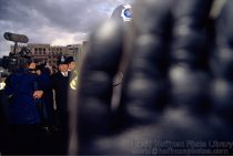Police officer covers my lens with his hand while his colleagues prevent TV crew from filming police assaults on striking Liverpool Dockers & Reclaim the Streets protesters in Trafalgar Square, London 1997.