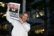 News of the World staff show the paper's last headline ever. London, UK, 09-07-2011