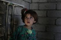 A young girl from Tal Affar stands in the construction site she is now staying in with many other families that have been displaced by fighting, in Sinjar, Iraq, on June 17, 2014. The area has been flooded with displaced families after some 50,000 people fled Tal Affar, which was taken over by Sunni militants two days ago.
[Sam Tarling for the Telegraph]
