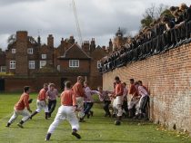 The Collegers and the Oppidans teams compete during the Eton Wall Game at Eton college in Eton November 17, 2012. Originating in 1766, the game is played on a narrow strip 110 metres long up against a wall. The idea is to move the ball along the wall with your feet and score a goal at the far end. Goals are very rare, the last one scored was a hundred years ago in 1909. REUTERS/ Eddie Keogh (BRITAIN - Tags: SPORT) - RTR3AM4W