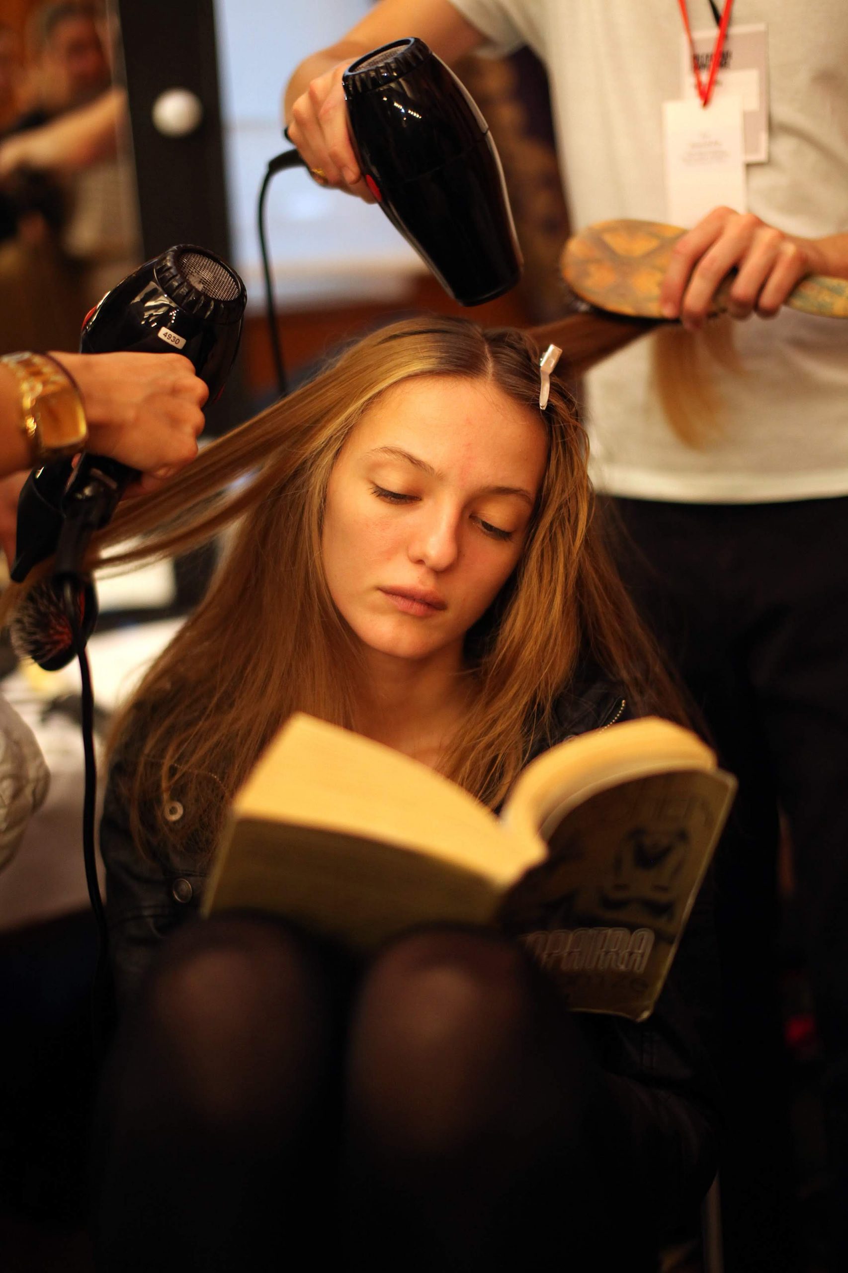 A model has her hair dried backstage at the Vivienne Westwood Red Label show, as part of London Fashion Week, London. PRESS ASSOCIATION Photo. Picture date: Sunday September 19, 2010. Photo credit should read: Katie Collins/PA Wire
