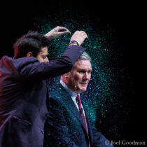 © Licensed to London News Pictures . 10/10/2023 . Liverpool , UK . Protester YAZ ASHMAWI invades the stage wearing a "People demand democracy" t-shirt and pours glitter on KEIR STARMER at the start of the Leader's Speech on the third day of the Labour Party Conference in Liverpool . Photo credit : Joel Goodman/LNP