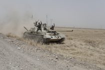 Kurdish Peshmerga drive a tank that was abandoned by the Iraqi army toward Kirkuk in Northern Iraq, near the current front line between ISIS and Kurdish forces near the town of Hwaija, on June 12, 2014.
[Sam tarling for the Telegraph]