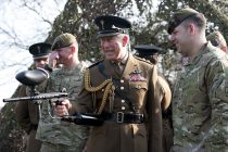 HRH  Prince Charles, The Prince of Wales being given a demonstration in how to fire a paintball gun by members of the 1st Battalion The Welsh Guards at Cavalry Barracks,  Hounslow, London on St David's Day.