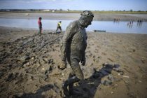 © London News Pictures. 05/05/2013. Malden, UK. Competitors take part in the Maldon Mud Race in Maldon, Essex on May 05, 2013. The race originated in 1973 and involves competitors racing around a course on the mudbanks of the river Blackwater at low tide. Photo credit: Ben Cawthra/LNP.