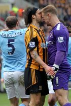 KINGSTON UPON HULL, ENGLAND - Manchester City's Joe Hart appears to headbutt George Boyd of Hull City after he went down in the penalty area after a challenge by Hart during the Premier League match between Hull City and Manchester City at the KC Stadium, Kingston upon Hull on Saturday 15th March 2014 (Credit: Mark Fletcher | MI News)