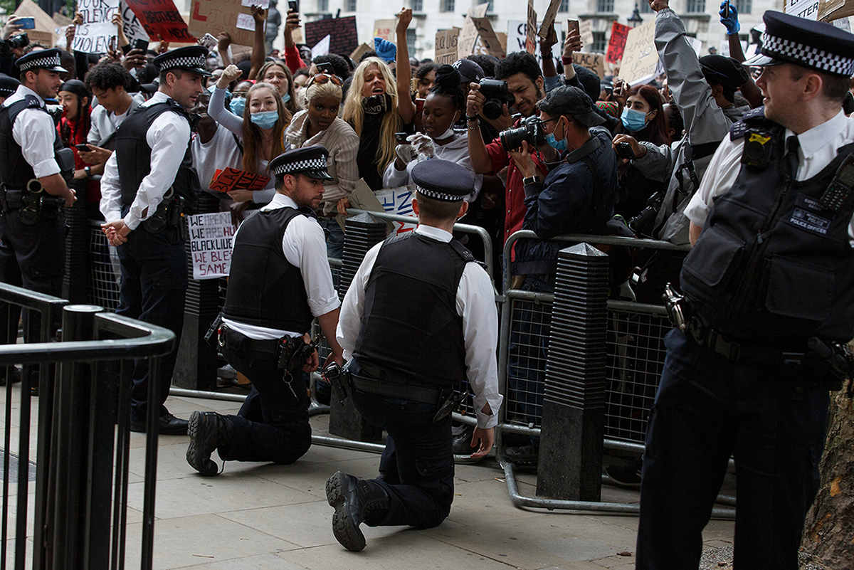 Black Lives Matter protest in London in solidarity for the illegal kill of George Floyd by police in Minneapolis.
MET police officers kneel in solidarity