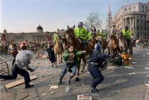 The day that finished Thatcherism. Poll Tax riot in Trafalgar Square, London  '90. A series of small riots and protests swept the country culminating in a mass march on Downing Street. Pushed up to Trafalgar Square and repeatedly attacked by police on horseback & in vehicles the protesters dispersed through the West End shopping areas starting fires and causing tens of millions of pounds damage. Hand coloured version.
© David Hoffman phone 0181 981 5041, email david@hoffmanphotos.com 
NUJ & BAPLA recommended terms & conditions apply. Moral rights asserted under Copyright Designs & Patents Act 1988. Full terms and conditions for digital and traditional use available on request. Credit is required. No part of this photo to be stored, reproduced, manipulated or transmitted by any means without permission.