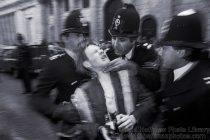 Stop the City, an Anti Economic anarchist demo to bring the City of London to a halt. Disorganised and massive it was surprisingly successful for most of the day. This PC is strangling a protester who had photographed him strangling a protester. It was that sort of day.
City of London. Thursday 29 September 1983