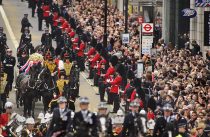 © Licensed to London News Pictures. 17.04.13 London, UK. Former British Prime Minister Margaret Thatcher's funeral procession makes it's way along Fleet Street to a service at St Paul's Cathedral, London.
Photo credit : Simon Jacobs/LNP