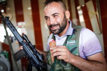 A member of the Free Syrian Army enjoys an ice cream on the road from Azaz to Aleppo, Syria, on Monday 10th of September [Sam Tarling]