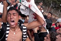 A palestinian protester demonstrating for his right to return reacts after Israeli soldiers opened fire on demonstrators  on the Lebanese border at Maroun ar Ras on Sunday 15 May 2011.  Israeli soldiers opened fire on the protesters, killing between 5 and 10 throughout the day  [Sam Tarling]