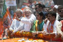 Varanasi, Uttar Pradesh, India. 24th April, 2014. Several thousand BJP supporters lined the streets of Varanasi to greet Narendra Modi as he visited the Uttar Pradesh city to file his nomination papers for the Lok Sabha elections.