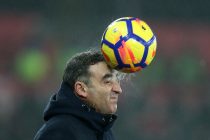 Swansea city manager Carlos Carvalhal heads the ball on the touchline and gets a wet face during the Premier league match, Swansea city v Tottenham Hotspur at the Liberty Stadium in Swansea, South Wales on Tuesday 2nd January 2018.
pic by Andrew Orchard, Andrew Orchard sports photography.