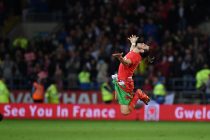 Gareth Bale of Wales jumps in the air with delight as he celebrates after the match as the Wales team qualify for Euro 2016 finals in France. Wales v Andorra, Euro 2016 qualifying match at the Cardiff city stadium in Cardiff, South Wales on Tuesday 13th October 2015.
pic by Andrew Orchard, Andrew Orchard sports photography.