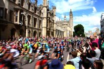 Stage Three of the Tour de France sets off from Cambridge, UK. The cycle race passes along the streets of Cambridge with Kings College in the background. The stage will see the riders go from Cambridge to London.
