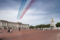 Day Forty Six of Lockdown, in London, which coincides with the 75th Anniversary celebrations of VE Day. The Red Arrows past past a very quiet Buckingham Palace and Queen Victoria Memorial, which would have been packed with people normally. Due to the country being on lockdown, many celebrations will have to take place in peoples homes and front gardens, whilst keeping socially distant from others. Large celebrations were to take place and The Mall was expected to be packed with people and the Royal family, including Queen Elizabeth II, would normally have been on the balcony of Buckingham ready to watch a flypast from the Red Arrows. The country is on lockdown due to the COVID-19 Coronavirus pandemic. People are not allowed to leave home except for minimal food shopping, medical treatment, exercise - once a day, and essential work. VE Day 75th Anniversary during COVID-19 Coronavirus lockdown, London, UK, on May 8, 2020