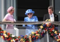 Queen Elizabeth II is all smiles as she watches the Investec Epsom Derby horse racing alongside her horse racing manager John Warren and Julia Budd Epsom racecourse chairman, Epsom, Surrey, UK on June 1, 2019.