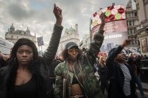 London, July 12th 2016. Up to 300 young protesters march through central London to take part in a Black Lives Matter demonstration. Beginning at the US Embassy in Grosvenor Square the protesters march to Downing Street via Oxford Street, Regent Street, Piccadilly Circus, Leicester Square and Trafalgar Square, then on to Millbank, Lambeth Bridge and  Westminster Bridge where the demonstrators blocked the road. Pictured:  Protesters march past Piccadilly Circus. // Lee Thomas, Flat 47a Park East Building, Bow Quarter, London, E3 2UT. Tel. 07784142973. Email: leepthomas@gmail.com. www.leept.co.uk (0000635435)