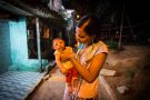 Daniele Ferreira dos Santos holds her son Juan Pedro, who was born with microcephaly, outside her house in Recife, Brazil, after a Zika virus outbreak.